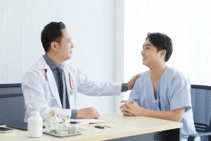 A patient consulting a doctor about PEP HIV treatment, discussing the need for HIV testing before starting the medication.
